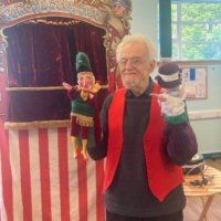 Professor John Pole with the newly refurbished puppets Professor John Pole with the newly refurbished puppets